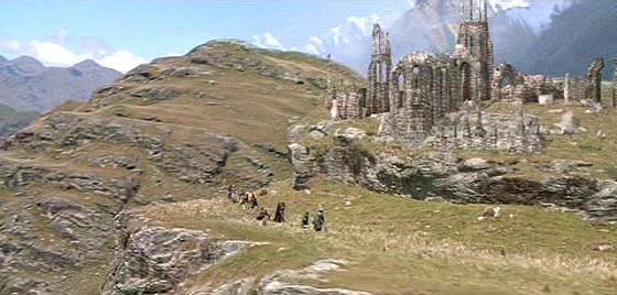 The Fellowship passing old ruins